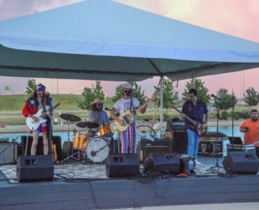 A local band performs at RIVERSPORT on the Rotary Point stage